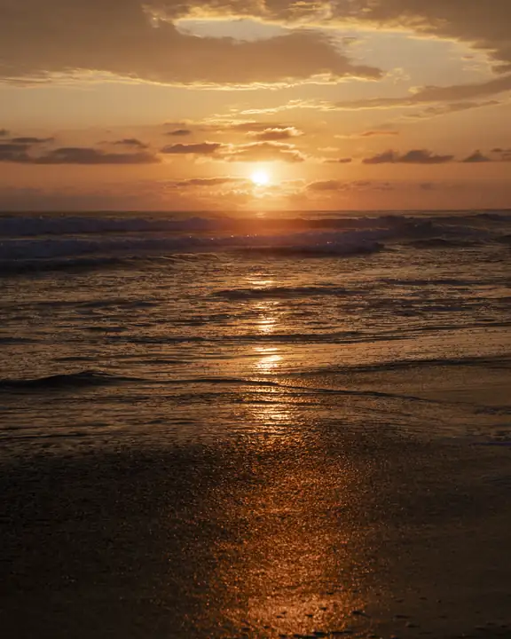 Sunset over the Pacific from the beach at Casa Uundu